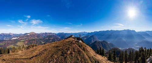 Drone shot, summit cross on the Schwarzer Berg with a view of the Lammertal with Dachstein massif
