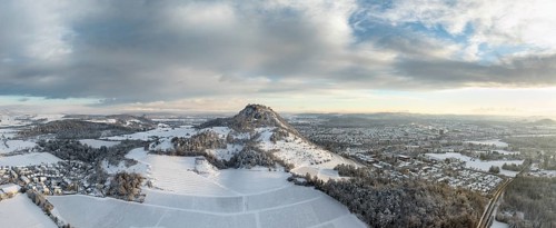 Aerial view, panorama of the snow-covered Hegau volcano Hohentwiel with Germany's largest castle