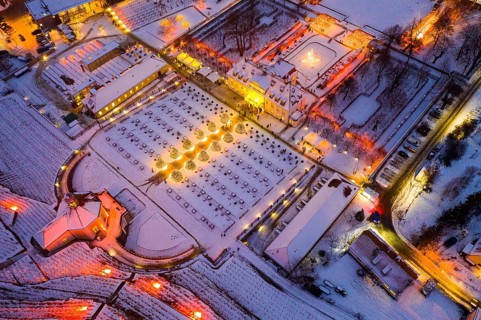 Aerial view of Wackerbarth Castle with castle park, belvedere and vineyards with snow and Christmas
