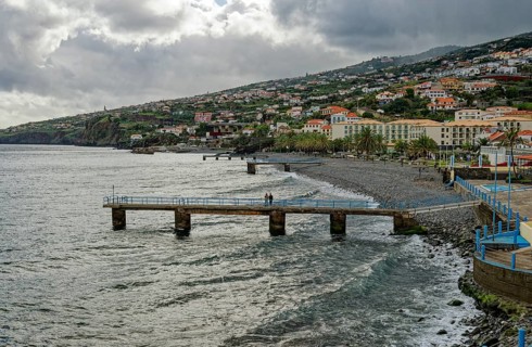 Promenade in rainy weather on the beach of the Atlantic Ocean, municipality of Santa Cruz, Madeira,