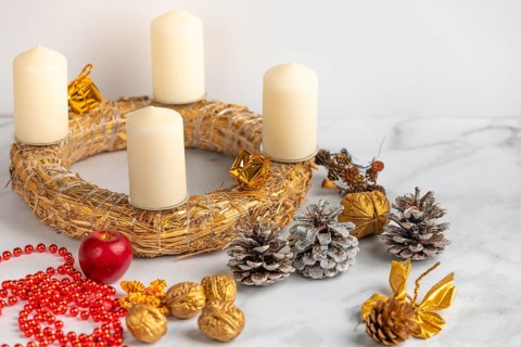 Making an Advent wreath, white candles, Christmas decorations, white background
