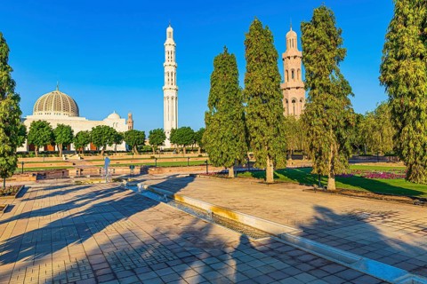 Park of the Sultan Qaboos Mosque, behind the mosque with the domes and minarets, Muscat, Arabian