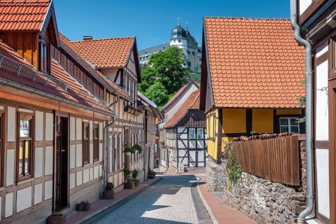 Street with half-timbered houses and cobblestones in the historic old town, behind the castle,