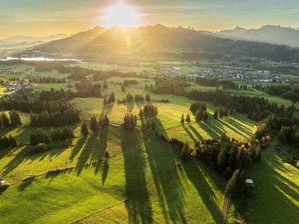 Mountain range near village Wertach, view to lake Gruentensee and village Wertach, sunrise, autumn