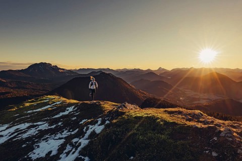 Trail running in autumn on the Jochberg on Lake Walchensee against the wonderful backdrop of the