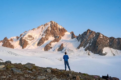 High alpine mountain landscape at sunset, Glacier du Tour, mountaineer in front of glacier and