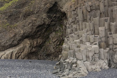 Reynisfjara Beach with Basalt rocks (Stuolabrrg) and the rock needles (Haidrangur), close to Vik i