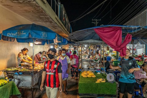 Food stalls with street food at the night market in Trat, Thailand, Asia