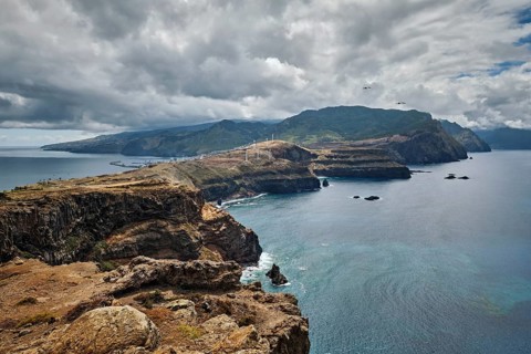 Madeira Island scenic rugged landscape view from Ponta do Sao Lourenco cape with seagulls flying.