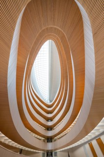 Futuristic interior design with spiral-shaped wooden structures and glass roof, UB- Recht, Zurich,