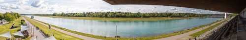 Wide panorama of a river flowing through a wooded landscape, Oberschleißheim regatta course