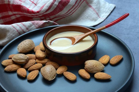 White almond cream in small bowls, almond butter