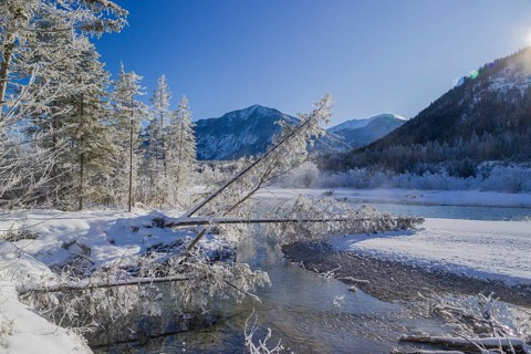 Isar valley in winter at temperatures of minus 18 degrees Celsius. Snow covered landscape with the