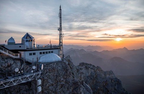 Mountain station of the Tyrolean Zugspitze railway at the summit of the Zugspitze, at sunset,
