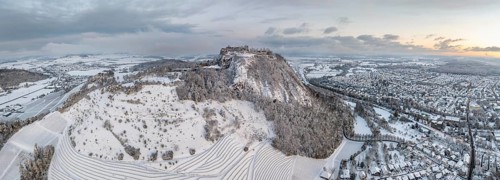 Aerial view, panorama of the snow-covered Hegau volcano Hohentwiel with Germany's largest castle