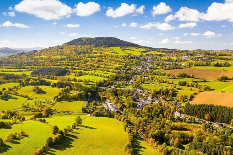 Eastern view of the Pöhlberg with the village of Geyersdorf from the air, Erzgebirge, Saxony,