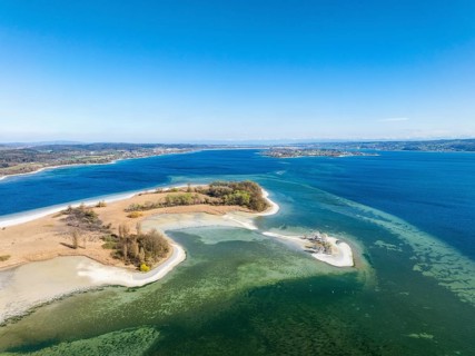 Aerial view of the Mettnau peninsula at low tide, on the right on the horizon the island of