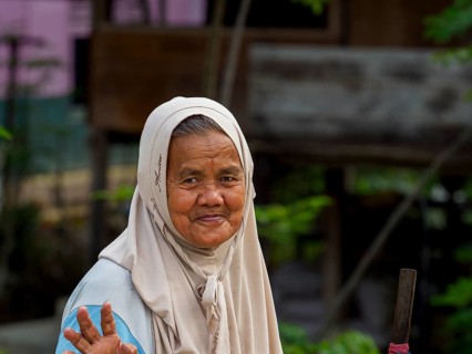 Old muslim woman, laughing with stick, Sulawesi, Indonesia, Asia