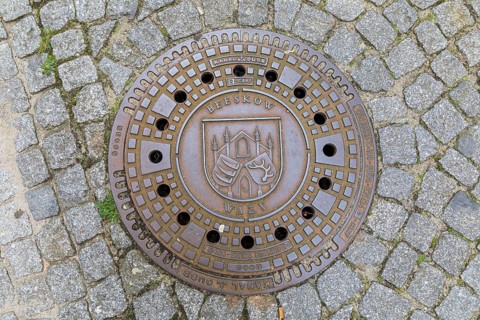 Manhole cover with coat of arms in Beeskow, Brandenburg, Germany, Europe