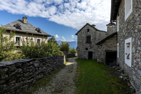 View of the village, typical Ticino stone houses in the mountain village of Rasa, Centovalli,