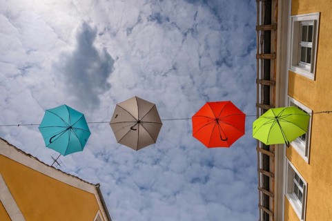 Colourful umbrellas stretched across the street, promising a prosperous and perfect life,