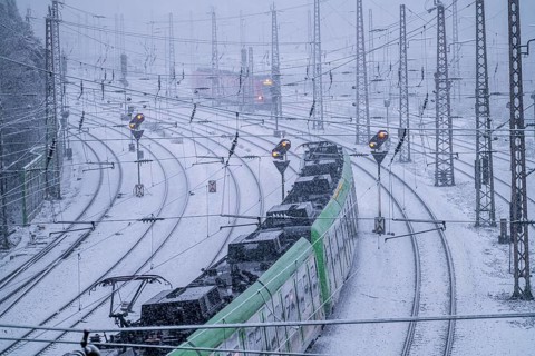 Winter weather, heavy snowfall, railway tracks in front of Essen main station, S-Bahn train, North