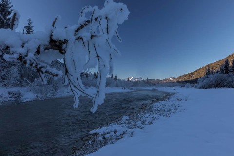 Isar valley in winter at temperatures of minus 18 degrees Celsius. Snow covered landscape with the