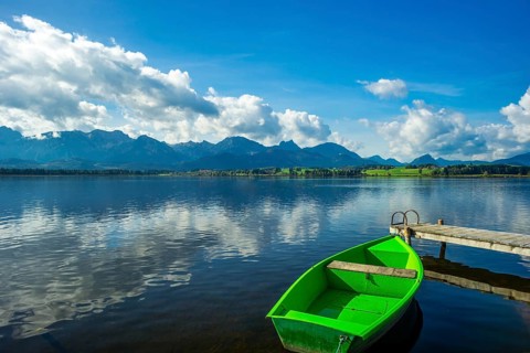 Green rowing boat, Hopfensee, Hopfen am See, near Füssen, Ostallgäu, Allgäu, Bavaria, Germany,