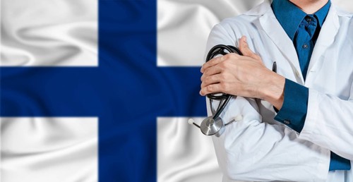 Doctor with stethoscope on Finland flag. Doctor holding stethoscope on Finland flag