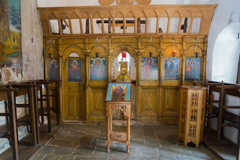 Iconostasis in an orthodox church with religious icons and a calm, spiritual atmosphere,