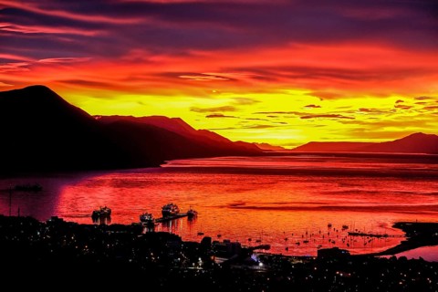 Ushuaia, Tierra del Fuego, Argentina, Glowing red sunrise over the Beagle Channel, the Beagle
