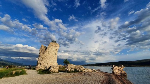 Panoramic view of a ruin on the waterfront in a cloudy blue sky, Vecka kula, Vecka Kula, Starigrad,