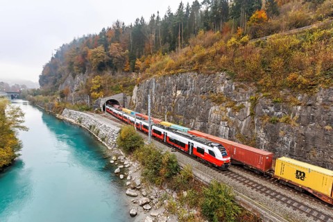 Train of the S-Bahn Vorarlberg and goods train of the Austrian Federal Railways ÖBB Eisenbahn in