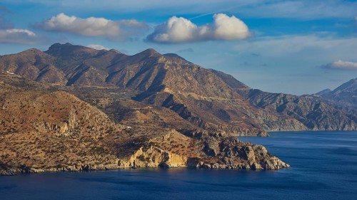 Mountains and sea under a cloudy sky, morning light, sunrise, coastal road, east coast, Karpathos,