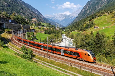 Railway passenger train of the type Stadler Flirt of the Südostbahn on the Gotthard railway in the