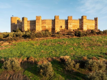 The impressive Moorish Burgalimar castle at the town of Baños de la Encina. Drone shot. Jaén