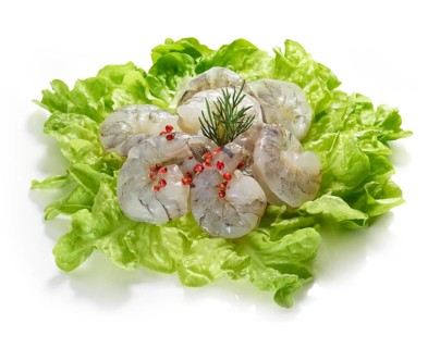 Raw prawns, decorated on lettuce leaves, studio shot