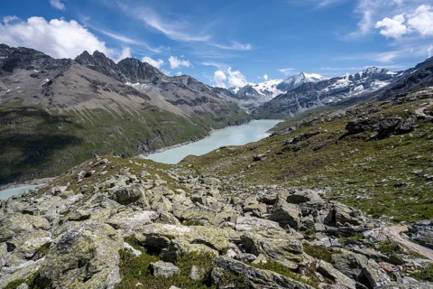 View of idyllic mountain landscape with blue mountain lake, Lac des Dix reservoir, behind mountain