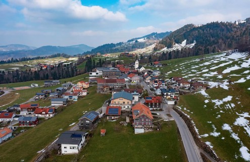 Drone image, residential buildings, settlement area, parish church, Riefensberg, Bregenzerwald,