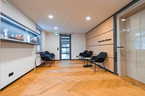 Modern waiting room with seating, wooden wall and decorative shelf, Nagold Town Hall, Black Forest,