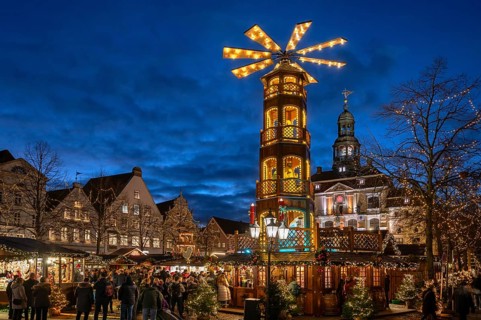 Large Christmas pyramid at the Christmas market on the market square, behind the historic town
