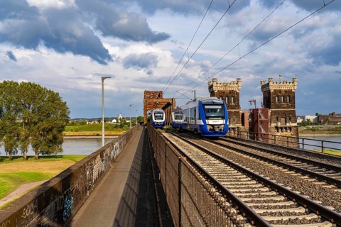 The railway bridge Duisburg-Hochfeld-Rheinhausen, over the Rhine, regional trains and many goods