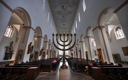 Interior of St Kilian's Cathedral, menorah in the centre aisle of the cathedral, created by Andreas