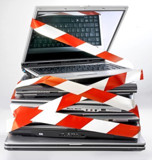 Pile of discarded notebooks, wrapped with barrier tape, disposal issue