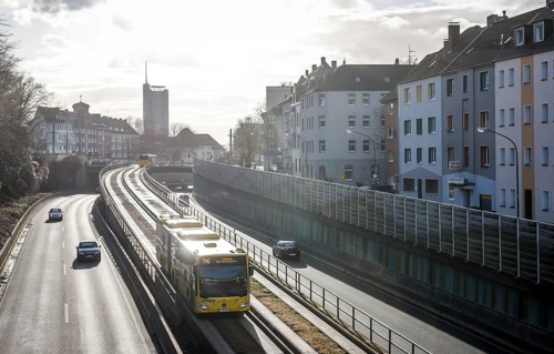 Essen, North Rhine-Westphalia, Germany - Cars and a public bus drive on the A40 motorway through