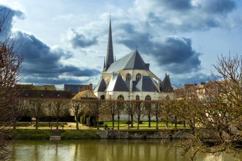Nemours. Saint-Jean-Baptiste church on river Loing. Seine-et Marne department. Ile-de-France.