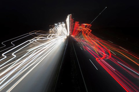 A7 Motorway, Autobahn, beside Kassel at night with light trails from the traffic headlights and