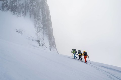 Dramatic atmosphere, Ski tourers, Snowy mountain landscape, Bernese Alps, Bernese Oberland,