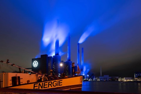 Illuminated cogeneration plant of Volkswagen, Volkswagen logo, the sky above the Mittelland Canal