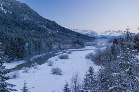 Isar valley in winter at temperatures of minus 18 degrees Celsius. Snow covered landscape with the